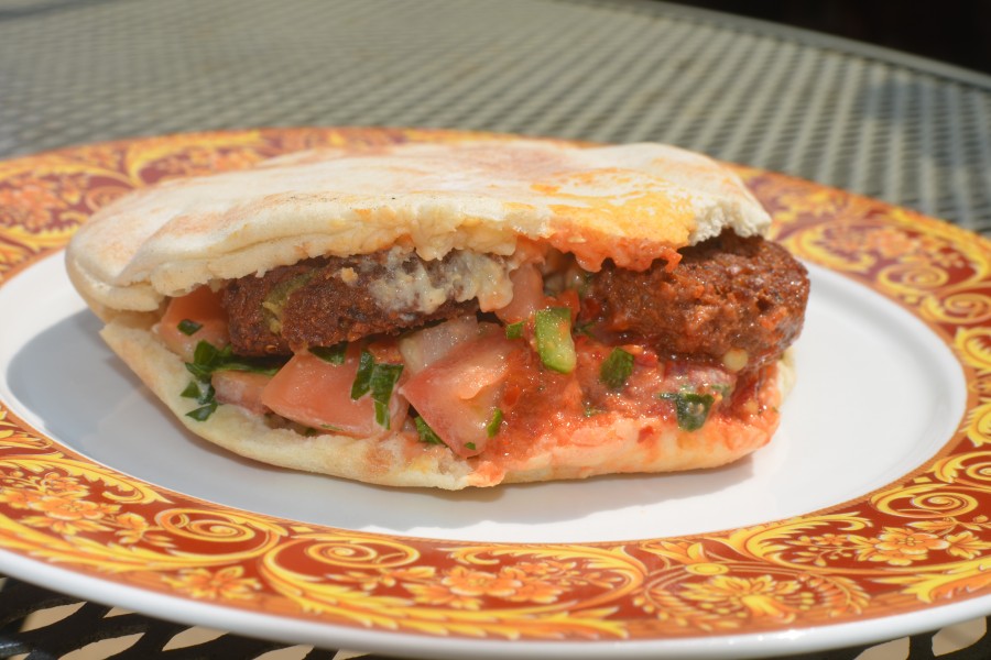 Eddie says he sells hundreds of falafel every week. This one is on pita with baba ghanouj and their spicy sauce.