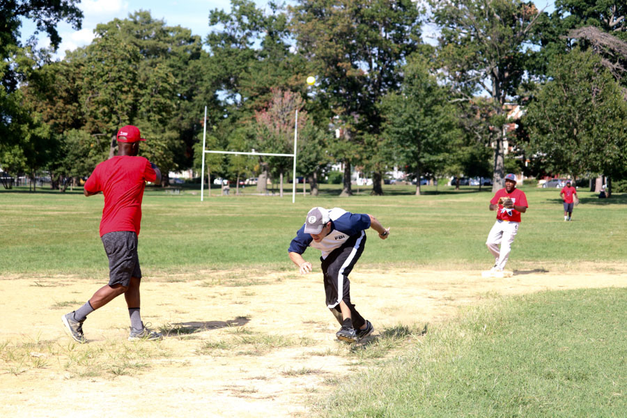 FBI player, Daron, runs for third base during the 10th annual Step Up to the Plate: Strike Out Violence softball game. /Kaitlyn Moore