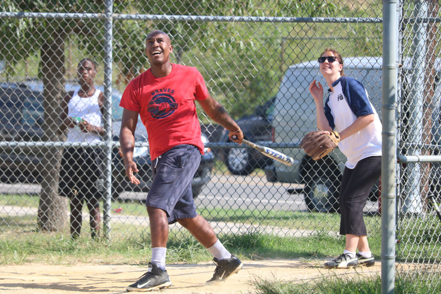 Strawberry Mansion teammate, Brandon Mundy looks on at his hit during the 10th annual Step Up to the Plate: Strike Out Violence softball game. /Kaitlyn Moore