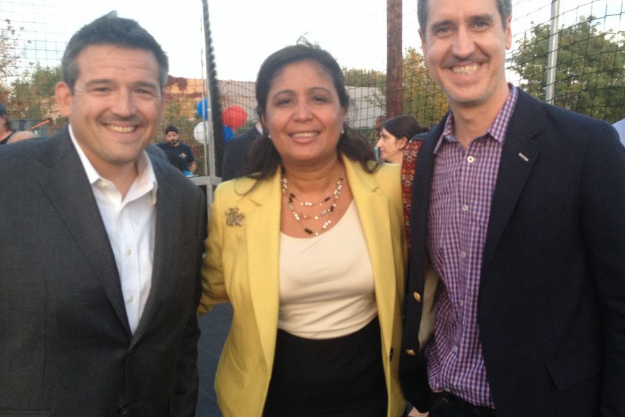 Casey O'Donnell - executive director of Impact Services CDC celebrates with Councilwoman Maria D. Quiñones-Sánchez and Brian Murray, Shift Capital Principal & CEO
