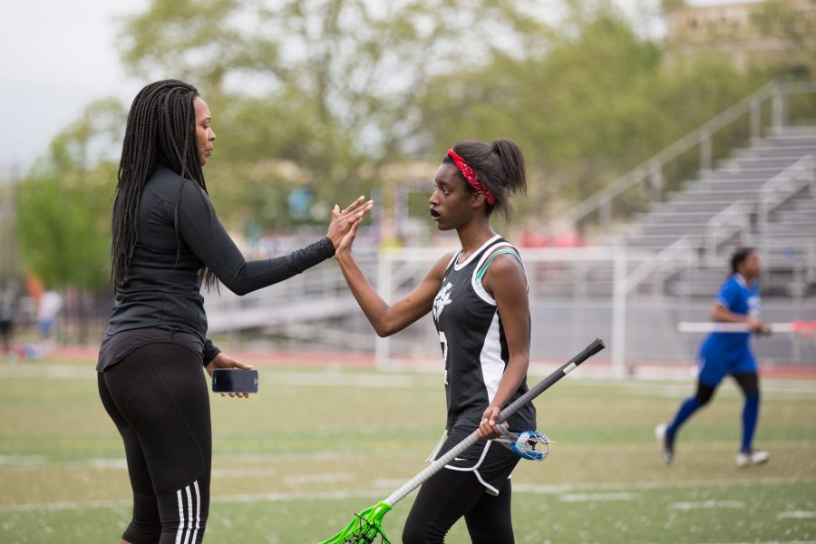Jasmine A. Smith high fives Nadirah “Na” Gateword following a stoppage of play. /Patrick Clark